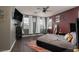 Bedroom with a ceiling fan, dark-painted walls, and a large window at 1766 Molly Meadows St, Las Vegas, NV 89115