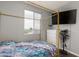 Bedroom with a gold canopy bed, light gray walls, and a window view at 1766 Molly Meadows St, Las Vegas, NV 89115