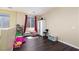 bedroom with dark floors and bright natural light at 1766 Molly Meadows St, Las Vegas, NV 89115