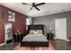 Bedroom with a queen bed, ceiling fan, and an accent wall at 1766 Molly Meadows St, Las Vegas, NV 89115