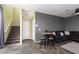 Open-concept living area featuring stairs and neutral colored walls at 1766 Molly Meadows St, Las Vegas, NV 89115