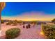Backyard desert landscaping with pots and a stone patio with views of the city at 1779 Sebring Hills Dr, Henderson, NV 89052