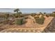 Lush backyard with stone walkways, decorative rock and privacy landscaping with views of the mountains at 1779 Sebring Hills Dr, Henderson, NV 89052