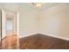 Clean, empty bedroom with hardwood floors, neutral walls, and a ceiling fan at 1779 Sebring Hills Dr, Henderson, NV 89052