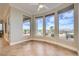 Breakfast nook with beautiful desert landscaping views and tile flooring provides natural light at 1779 Sebring Hills Dr, Henderson, NV 89052