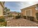 Paver-covered courtyard surrounded by mature hedges providing privacy and curb appeal at 1779 Sebring Hills Dr, Henderson, NV 89052