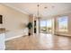 Dining room features sliding doors to outside, tiled floors, and modern light fixture at 1779 Sebring Hills Dr, Henderson, NV 89052