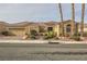 Inviting single-story home featuring desert landscaping and a two-car garage at 1779 Sebring Hills Dr, Henderson, NV 89052