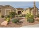 Charming home with meticulous desert landscaping, a brick walkway and mature plantings at 1779 Sebring Hills Dr, Henderson, NV 89052