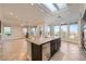 Open-concept kitchen with granite countertops, stainless steel appliances, and tile floors at 1779 Sebring Hills Dr, Henderson, NV 89052
