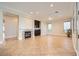 Open living room featuring a fireplace, tile flooring and plenty of natural light at 1779 Sebring Hills Dr, Henderson, NV 89052