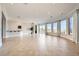 Spacious living room featuring tiled floor, recessed lighting, bar area, and sliding doors to backyard at 1779 Sebring Hills Dr, Henderson, NV 89052