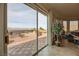 Bright living room with backyard view through glass sliding doors at 1779 Sebring Hills Dr, Henderson, NV 89052