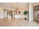 Open-concept living room features tiled floors, recessed lights, and adjacent wet bar at 1779 Sebring Hills Dr, Henderson, NV 89052