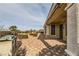 Charming covered patio with brick pavers and an outdoor kitchen area provides ample space for entertaining at 1779 Sebring Hills Dr, Henderson, NV 89052