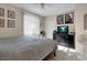 Cozy bedroom with a dresser, media center and a great ceiling fan at 1830 N Buffalo Dr # 2043, Las Vegas, NV 89128