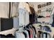 Walk-in closet with built-in shelving and ample storage for clothes and shoes at 1830 N Buffalo Dr # 2043, Las Vegas, NV 89128