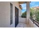 Welcoming entryway with tiled floor, secure entry door and view of exterior at 1830 N Buffalo Dr # 2043, Las Vegas, NV 89128