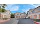 Lovely condominium complex featuring attached garages and neatly maintained landscaping at 1830 N Buffalo Dr # 2043, Las Vegas, NV 89128