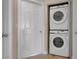Modern laundry room featuring a stacked washer and dryer unit at 1830 N Buffalo Dr # 2043, Las Vegas, NV 89128