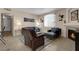 Inviting living room featuring a fireplace and comfortable seating arrangement at 1830 N Buffalo Dr # 2043, Las Vegas, NV 89128