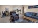 Open concept living room with tile floors, leading into dining and kitchen at 1830 N Buffalo Dr # 2043, Las Vegas, NV 89128