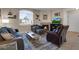 Comfortable living room featuring a fireplace and large window at 1830 N Buffalo Dr # 2043, Las Vegas, NV 89128