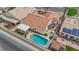 Aerial view of a private backyard with a pool, hot tub, and covered patio at 206 Red Cloud Ter, Henderson, NV 89015