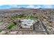 Wide aerial view of community buildings, green spaces, and residences with mountains in the distance at 206 Red Cloud Ter, Henderson, NV 89015