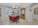 Cozy dining room featuring a table, chandelier, and plenty of natural light at 206 Red Cloud Ter, Henderson, NV 89015