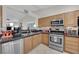 Traditional kitchen with stainless steel appliances and granite countertops at 206 Red Cloud Ter, Henderson, NV 89015
