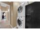 Efficient laundry area includes stacked washer/dryer units and ample storage at 206 Red Cloud Ter, Henderson, NV 89015