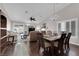 Bright open floor plan featuring a combined living and dining room, hardwood floors, and abundant natural light at 206 Red Cloud Ter, Henderson, NV 89015