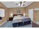 Comfortable primary bedroom features carpeted floors, a ceiling fan and ample closet space at 206 Red Cloud Ter, Henderson, NV 89015