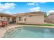 Refreshing pool featuring convenient access stairs and covered patio at 206 Red Cloud Ter, Henderson, NV 89015
