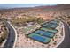 Extensive aerial view showing the community's amenities, including sports courts, and surrounding landscape at 2585 Shellsburg Ave, Henderson, NV 89052