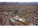 Vast aerial view showcasing the community layout with pool, tennis courts, and scenic mountain views at 2585 Shellsburg Ave, Henderson, NV 89052