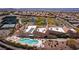 Stunning aerial view of the community center with a pool, tennis courts, and lush landscaping at 2585 Shellsburg Ave, Henderson, NV 89052