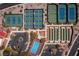 Aerial view showcasing multiple well-maintained tennis and bocce ball courts alongside a parking lot within the community at 2585 Shellsburg Ave, Henderson, NV 89052
