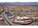 Expansive aerial shot of a community showcasing multiple tennis courts, a pool, and a building perfect for recreation and leisure at 2585 Shellsburg Ave, Henderson, NV 89052