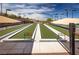Dual bocce ball courts featuring well manicured artificial turf and shaded awnings, ready for a friendly game at 2585 Shellsburg Ave, Henderson, NV 89052