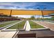 Open bocce ball court featuring well-groomed playing surface, overhead shade structures, and a beautiful landscaped surrounding at 2585 Shellsburg Ave, Henderson, NV 89052