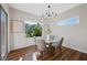 Dining room with contemporary lighting and a glass table with seating for four at 2585 Shellsburg Ave, Henderson, NV 89052
