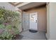 Inviting entryway featuring a secure screen door and a well-lit, covered porch at 2585 Shellsburg Ave, Henderson, NV 89052