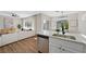 Modern kitchen with stainless steel appliances, sleek countertops, and an open layout into the living area at 2585 Shellsburg Ave, Henderson, NV 89052