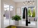 Close-up of a modern kitchen faucet and plant, with a view of the backyard and dining area at 2585 Shellsburg Ave, Henderson, NV 89052