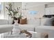 Bright living room featuring a comfortable sectional sofa, stylish decor, and natural light at 2585 Shellsburg Ave, Henderson, NV 89052
