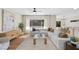 Bright and airy living room featuring modern decor, hardwood floors, and large windows at 2585 Shellsburg Ave, Henderson, NV 89052
