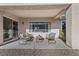 Charming covered patio featuring comfortable seating and a relaxing outdoor space at 2585 Shellsburg Ave, Henderson, NV 89052