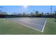 Community tennis court with well-maintained surface and surrounding greenery at 2585 Shellsburg Ave, Henderson, NV 89052